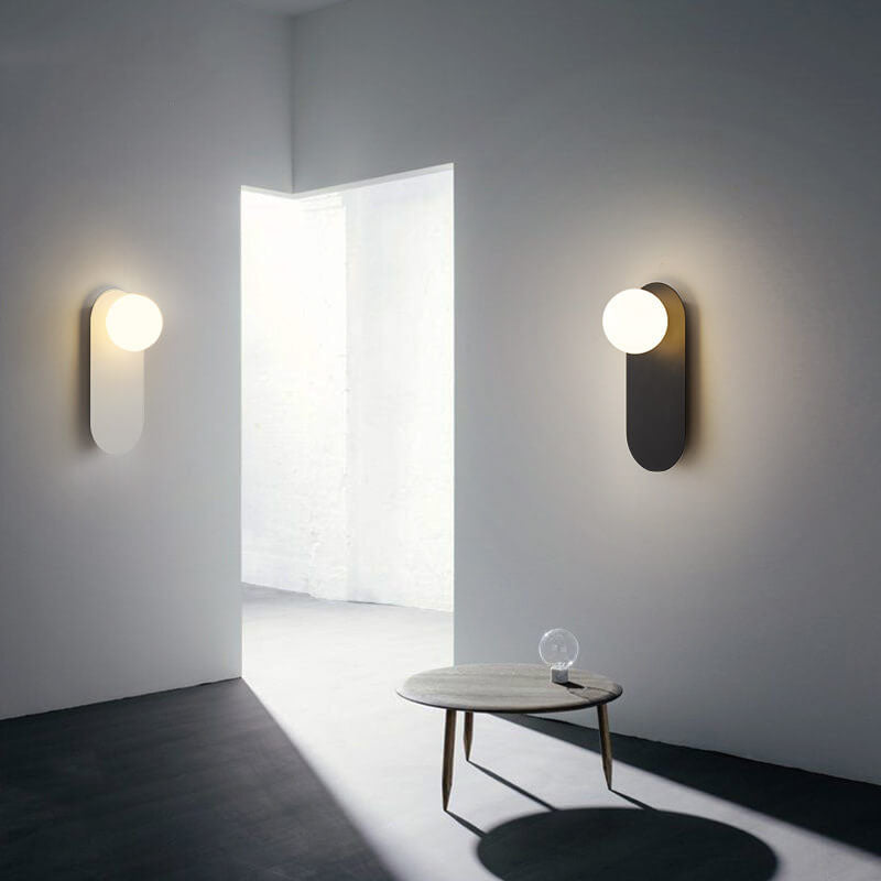 Nordic globe wall sconce with oval backplate