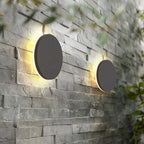 Minimalist round LED wall sconce