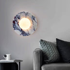 Marble wall sconce with frosted globe