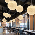 Lunar Glow moon pendant light with textured resin shade