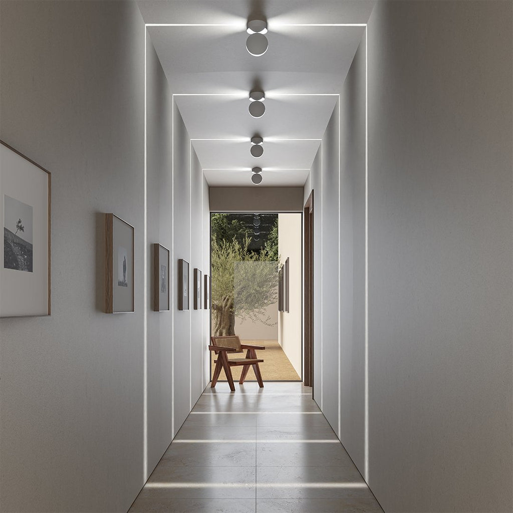 Rotating circular LED ceiling light in matte white